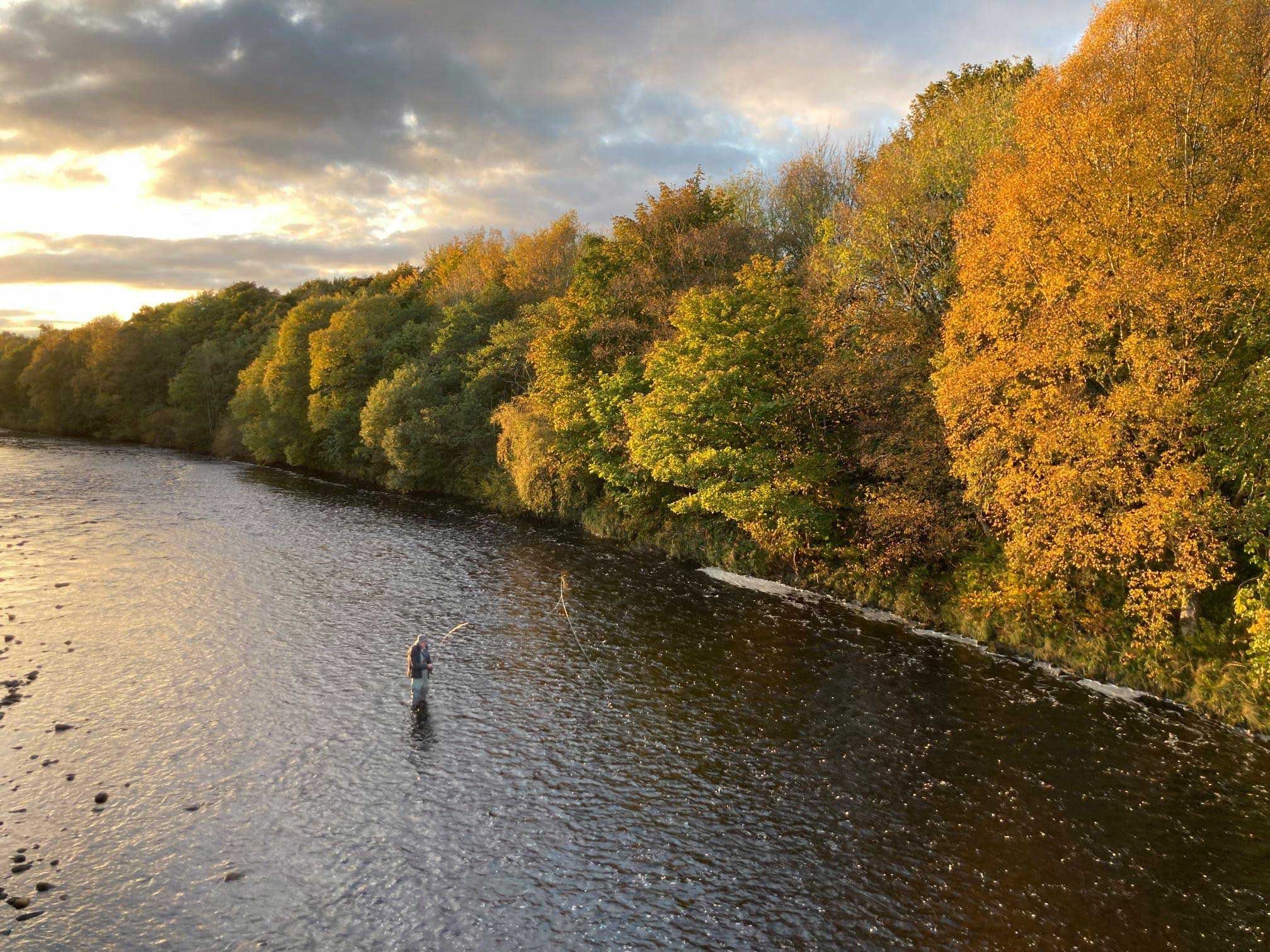 An angler wading in the River South Tyne.